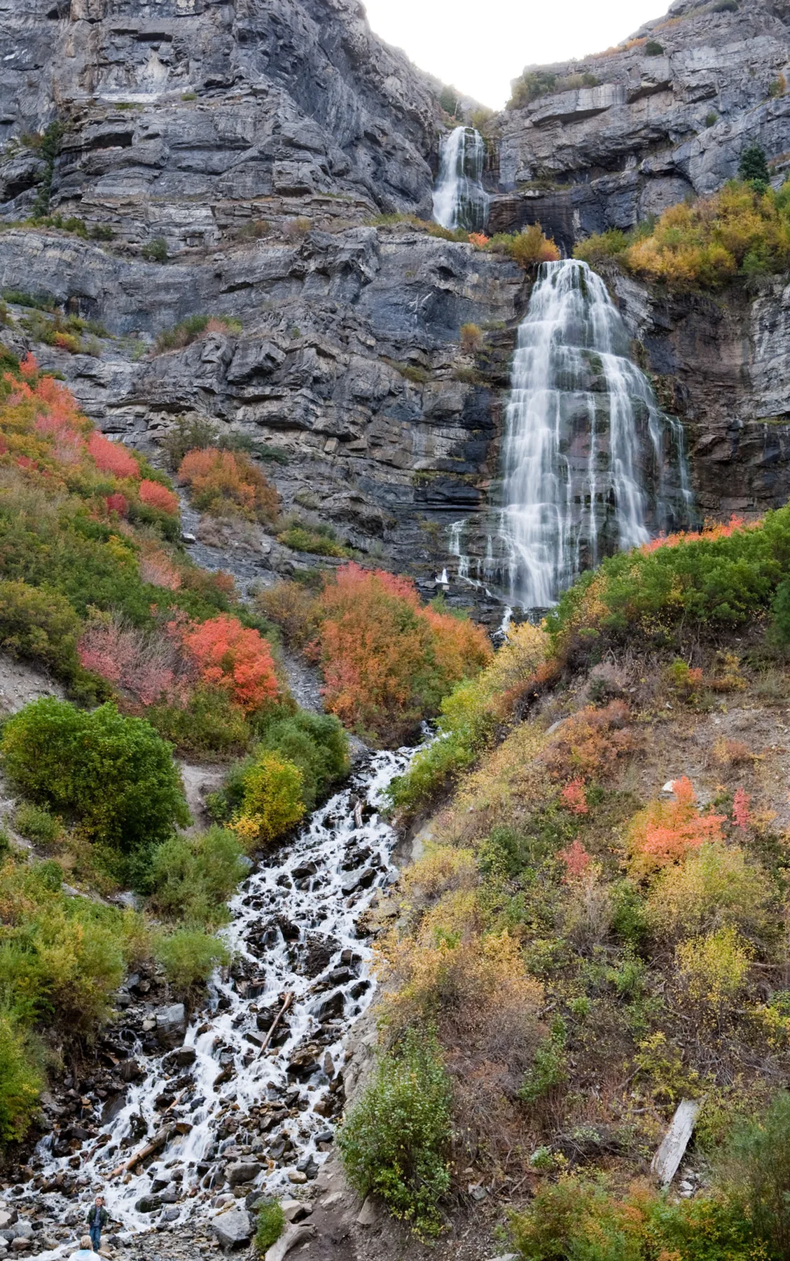Bridal Veil Falls descending through autumn foliage in Provo Canyon