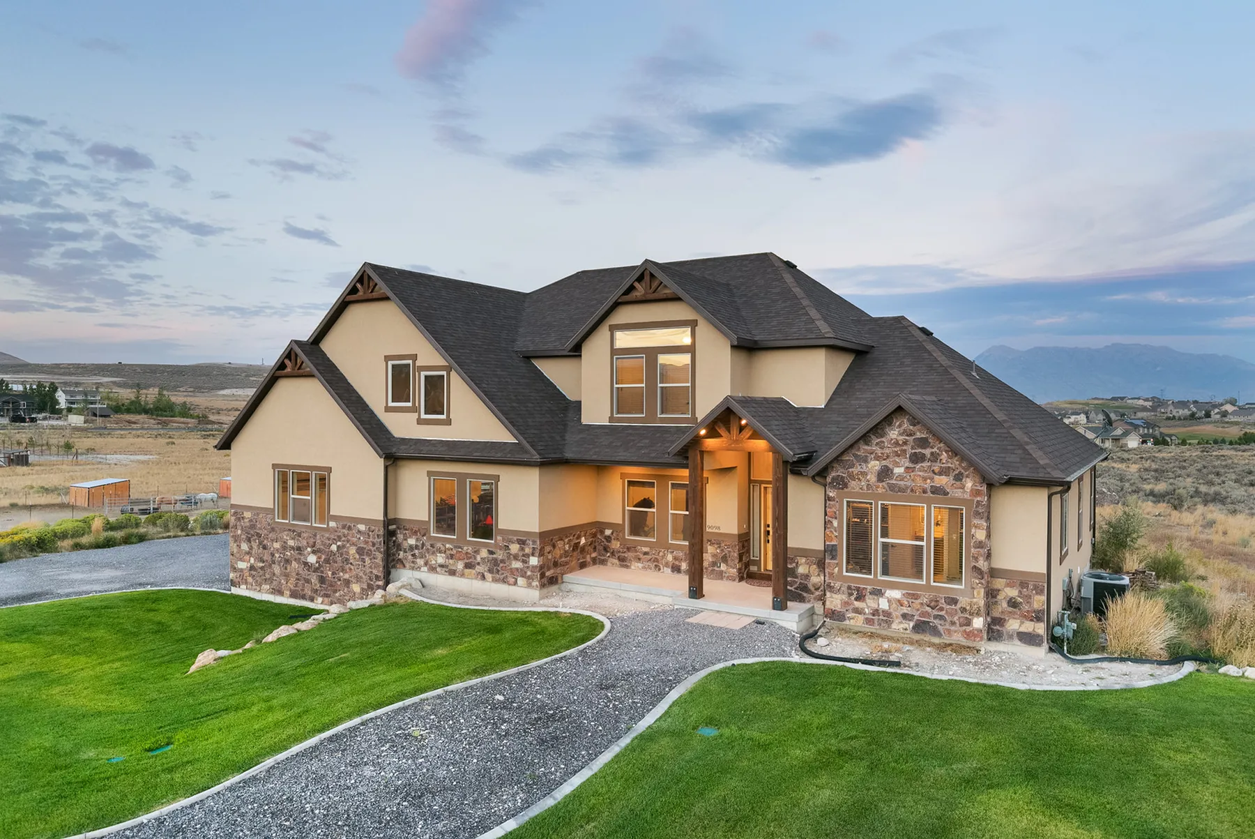 Home in an open Eagle Mountain setting with mountains beyond